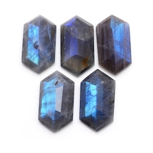 May include: Five iridescent blue and gray labradorite gemstone cabochons in a hexagonal shape.