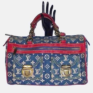 Sold at Auction: LOUIS VUITTON DENIM HANDBAG WITH RED ACCENTS