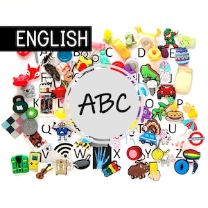 May include: A selection of colourful miniature charms and embellishments, including letters, animals, and objects. The word "ENGLISH" is displayed above the charms, and the letters "ABC" are in the centre.