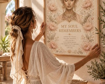May include: A framed wall art print featuring a central illustration of a person wearing an ornate headpiece, surrounded by floral motifs. The text reads: MY SOUL REMEMBERS, I HONOR THE WISDOM THAT LIVES WITHIN ME, I TRUST THE PATH, I HAVE WALKED BEFORE.