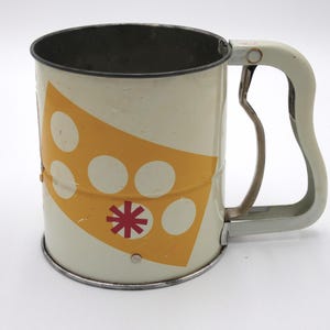 Mid-century Androck rotary hand sifter- atomic red and yellow flour sifter