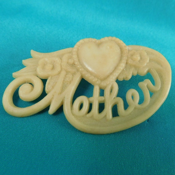 Carved Bakelite Mother Brooch Pin Butterscotch Te… - image 1