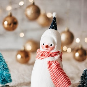 Plush snowman figurine with a red scarf whimsical winter decoration image 1