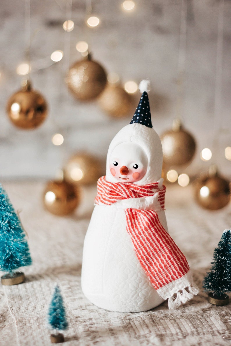 Plush snowman figurine with a red scarf whimsical winter decoration image 1