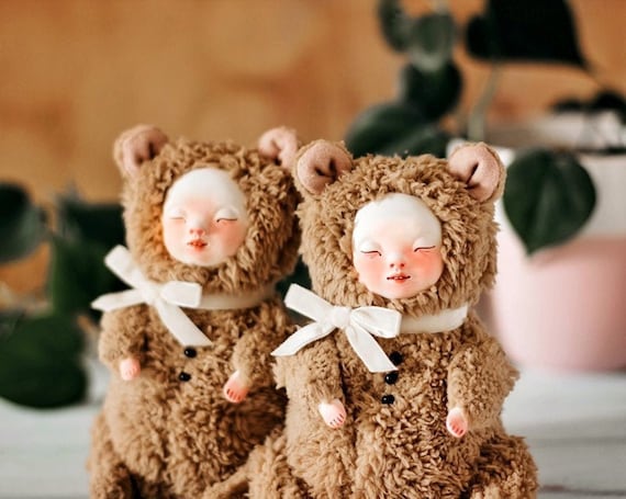 teddy bear with doll face
