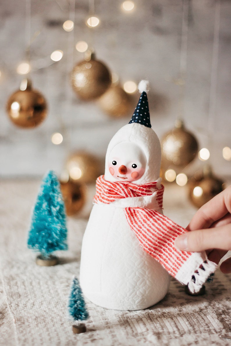 Plush snowman figurine with a red scarf whimsical winter decoration image 2