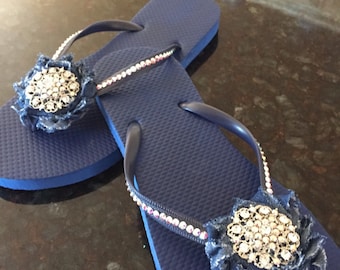 Gorgeous navy flip flop with denim flower and brooch encrusted in swarovski crystals. Custom made and available in all sizes