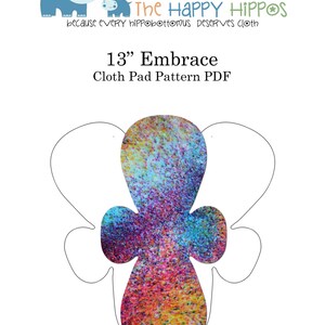 May include: A printable pattern for a 13-inch cloth pad, shaped like a stylized flower with a colorful, speckled design. The pattern is outlined in black and is ready to be cut out and sewn.