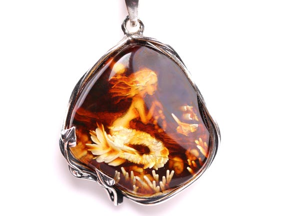 Handcarved Amber Mermaid Pendants Handcarved Amber Mermaid Pendants