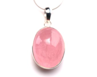 May include: A silver pendant featuring a large, oval-shaped, pink gemstone. The gemstone is set in a silver bezel and hangs from a delicate silver chain. The pendant is displayed against a white background.