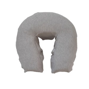 May include: A gray u-shaped neck pillow for relaxation and comfort.
