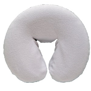 May include: White, soft, plush, horseshoe-shaped pillow for a massage table.