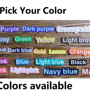 May include: Image displaying a variety of color options, each labeled on a rectangular block. Colors include Khaki, Purple, Dark Purple, Creamy White, Red, Gray, Green, Yellow, Light Brown, Royal Blue, Dark Blue, Gold, Lemon, Orange, Brown, Dark Pink, Blue, Light Blue, Black, White, Hot Pink, Light Pink, Navy Blue, and Maroon.