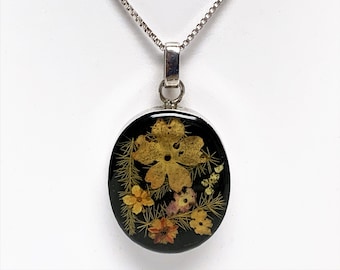 Natural Petite Colorful Flowers Captured in Clear Resin and Sterling Silver Oval Setting 30X25 mm, 16” Sterling Silver Box Chain. 11 Grams.