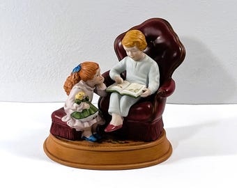 Avon ©1983 Christmas Memories™ Sculpted Figurine "Enjoying The Night Before Christmas". Bisque Porcelain. 5.7" W. 5.5" T. Free US Shipping