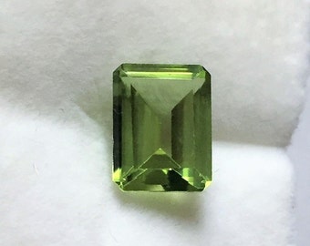 Genuine Natural Green Peridot, Emerald Cut Loose Gemstone, 9.10 X 7 mm, 2.60 carats. Light Olive Green