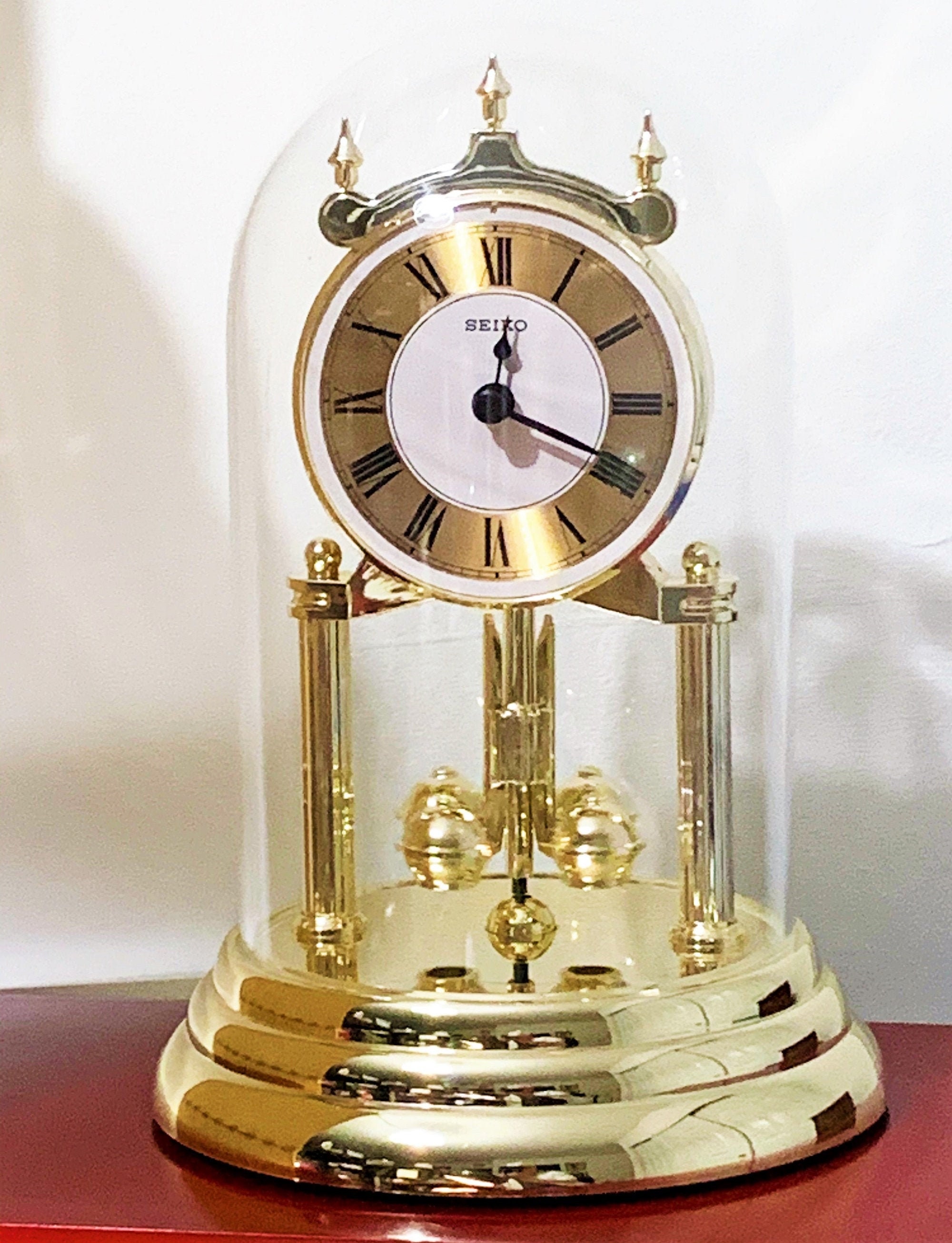 Seiko Anniversary Clock Glass Dome Rotating Pendulum, Gold Finish, 9 High.  6 Base, Mint Condition. Free US Shipping.