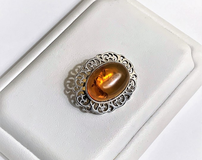 Vintage Sterling Baltic Amber Brooch, Oval Cabochon Honey Amber 18X13 mm, Cut-Out Scrolls Pattern. 27mm - 1 1/8", England