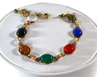 Vintage 1960's 12K Gold Filled Scarab Bracelet, 7 Carved Gemstones Scarabs 12X10mm, Safety Chain, Good Condition. 7.5" L. Free US Shipping