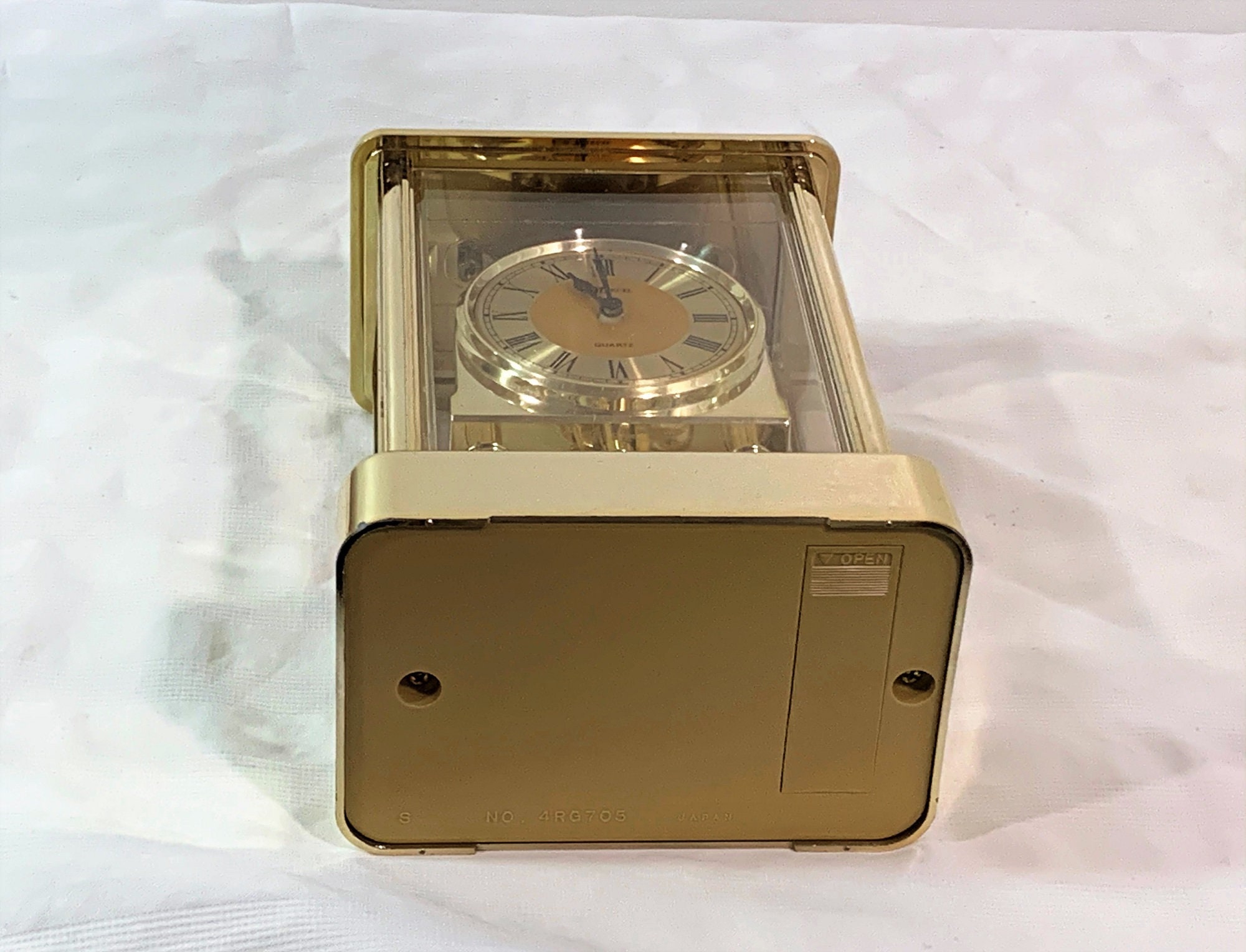 Marcel Japan Carriage Revolving Pendulum Clock, Brass Marcel Japan Carriage Revolving Pendulum Clock, Brass