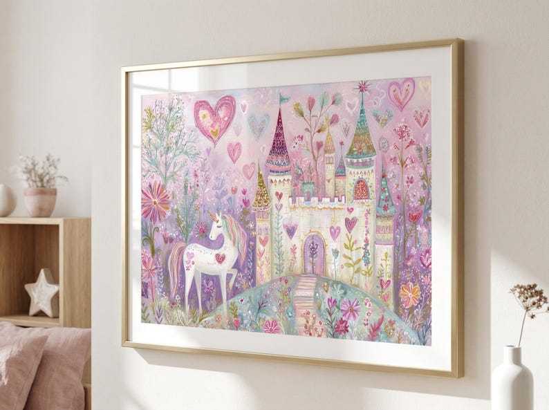May include: A framed wall art print featuring a white unicorn standing in a garden with a castle in the background. The scene is filled with pink and purple hearts, colourful flowers, and tall towers. The artwork is encased in a thin gold frame.