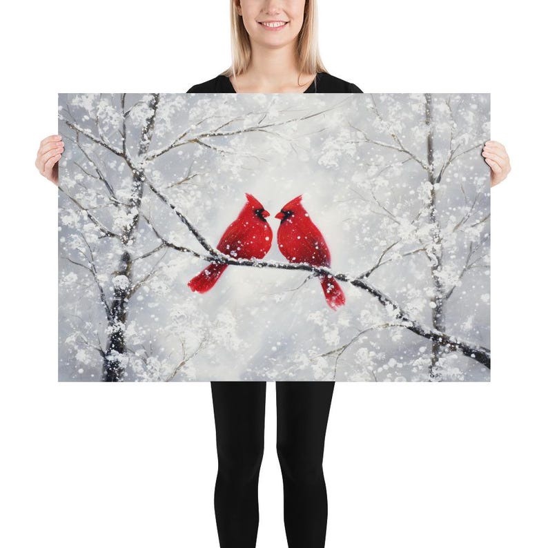 May include: A winter-themed painting featuring two vibrant red cardinals perched on a snow-covered branch. The background is a soft, blurred depiction of a snowy forest, with white and gray tones. The artwork evokes a sense of peace and the beauty of nature.