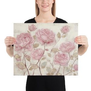 May include: A floral print featuring large, pink roses with green and gold leaves on a cream-colored background. The artwork has a painterly style, with visible brushstrokes and a soft, romantic feel. The roses are in full bloom.