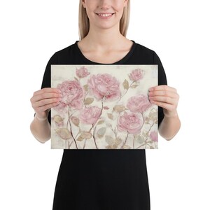 May include: A floral print featuring soft pink roses on a cream-colored background. The artwork showcases a painterly style with delicate brushstrokes, creating a vintage aesthetic. The roses are in various stages of bloom.