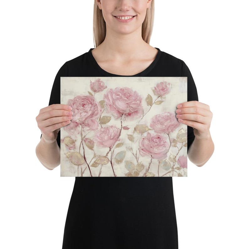 May include: A floral print featuring soft pink roses on a cream-colored background. The artwork showcases a painterly style with delicate brushstrokes, creating a vintage aesthetic. The roses are in various stages of bloom.