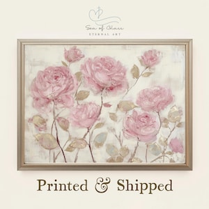 May include: A framed floral print featuring a soft, painterly depiction of pink roses. The artwork has a neutral background and is accented with muted green and gold leaves. The text "Sea of Clair Eternal Art" is at the top, and "Printed & Shipped" is at the bottom.