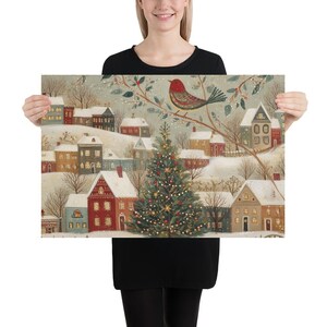 May include: A rectangular print featuring a winter village scene with snow-covered houses, a central decorated Christmas tree, and a large red bird perched on a branch. The illustration uses a muted colour palette of red, green, and white.