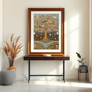 May include: A framed print of a colourful painting depicting a tree with fruit and birds. The tree is surrounded by flowers and a stream. The print is hanging on a white wall above a dark brown console table with black metal legs.