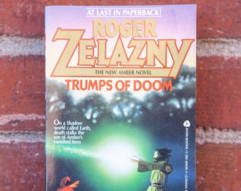 Trumps of Doom by Roger Zelazny / ©1986, February, First Avon Books Printing / Science Fiction Novel from the 'Chronicles of Amber' Series