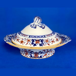 Mintons Imari lidded tureen, or vegetable dish, with floral patterns in blue and orange, yellow rims, early Art Deco design