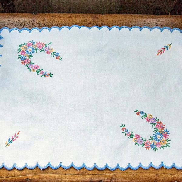 Vintage hand embroidered tray cloth, or sideboard mat, decorated with dainty floral patterns and scalloped edging