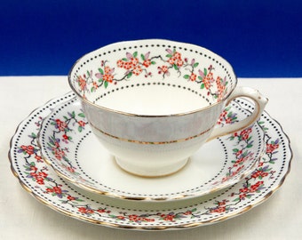 Antique tea cup, saucer and plate, New Chelsea Porcelain Co trio, with hand enamelled 'Thornlea' ditsy floral pattern, 1920s