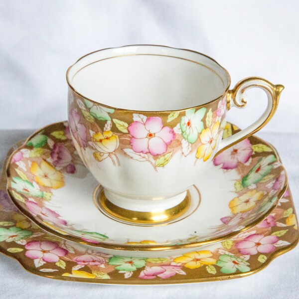 Beautiful pink and yellow fine bone china cup, saucer and plate set