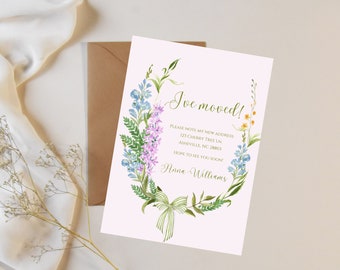 May include: A floral wreath with blue, purple, and yellow flowers surrounds the text "I've moved!" with a new address and the name "Anna Williams".