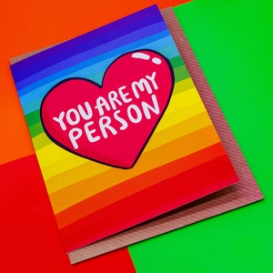 A Katie Abey A6 rainbow backed greeting card with a big red hear in the middle and the words inside You are my person