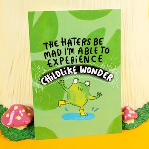 Carte postale A6 Childlike Wonder Frog - imprimé grenouille - Katie Abey - cadeau mignon - sain - lutin - fée - cadeau grenouille - imprimé vert - positivité