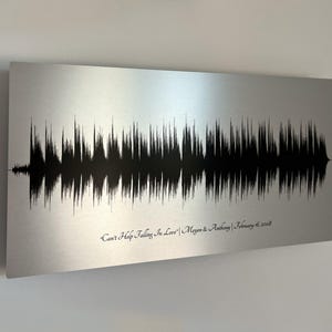 Personalized sound wave art depicting a couple's wedding song, a unique and thoughtful 10 year anniversary gift for a husband printed on tin.