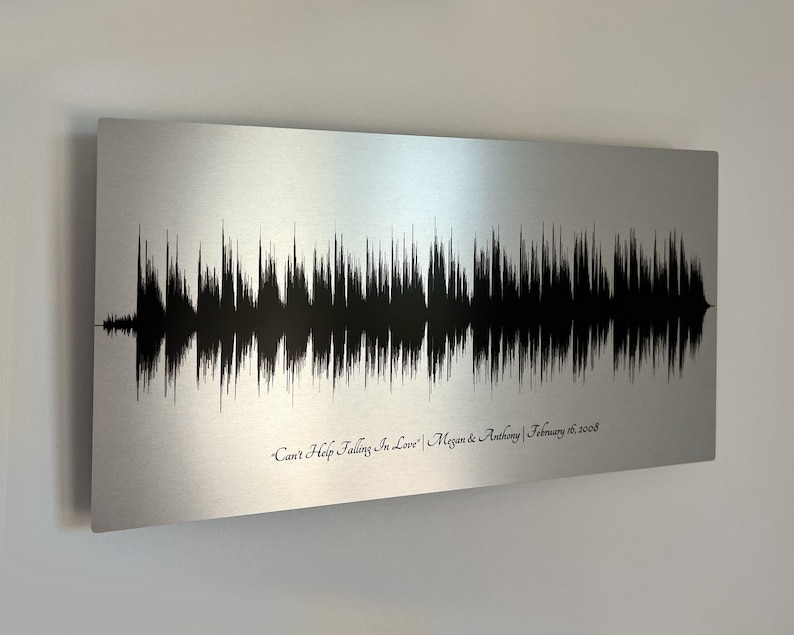 Personalized sound wave art depicting a couple's wedding song, a unique and thoughtful 10 year anniversary gift for a husband printed on tin.