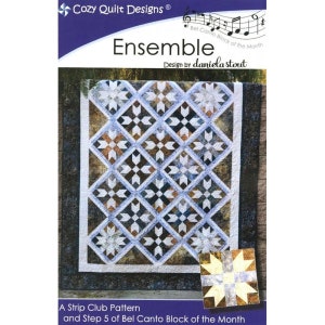 May include: A quilt pattern titled "Ensemble" designed by daniela stout. The quilt features a blue, white, and brown color scheme with a star-shaped pattern. The quilt is a strip club pattern and step 5 of the Bel Canto Block of the Month.