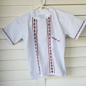 Boy&#39;s Guayabera 2 button shirt with banded collar and pocket - White with red embroidery