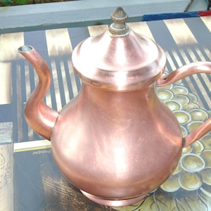 May include: A trio of ceramic mugs with a speckled, matte finish in light blue, cream, and grey. The mugs have a simple, modern design and a comfortable handle, perfect for tea or coffee.