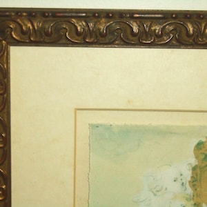 May include: A framed artwork with a gold ornate frame. The artwork is a watercolor painting of a light blue sky with white clouds and a brown and gold object in the bottom right corner.
