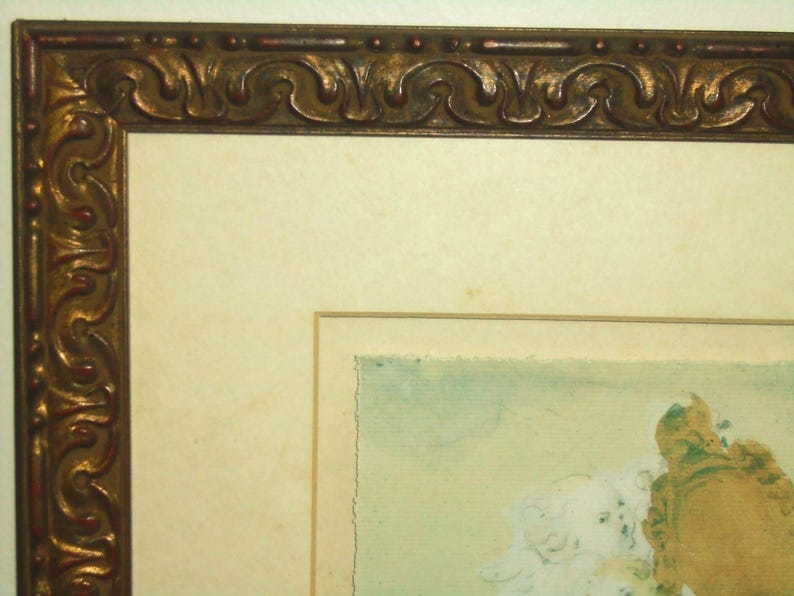 May include: A framed artwork with a gold ornate frame. The artwork is a watercolor painting of a light blue sky with white clouds and a brown and gold object in the bottom right corner.