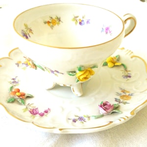 German Bisque Porcelain, 3 Demensional Florals Demitasse Cup and Saucer. Demitasse Cup and Saucer.  ISCO GERMANY, Florals