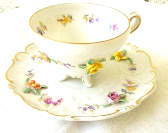 German Bisque Porcelain, 3 Demensional Florals Demitasse Cup and Saucer. Demitasse Cup and Saucer.  ISCO GERMANY, Florals