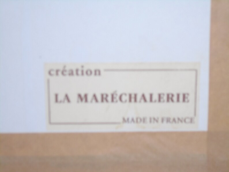 May include: A white label with brown text that reads "creation LA MAR&Eacute;CHALERIE MADE IN FRANCE".